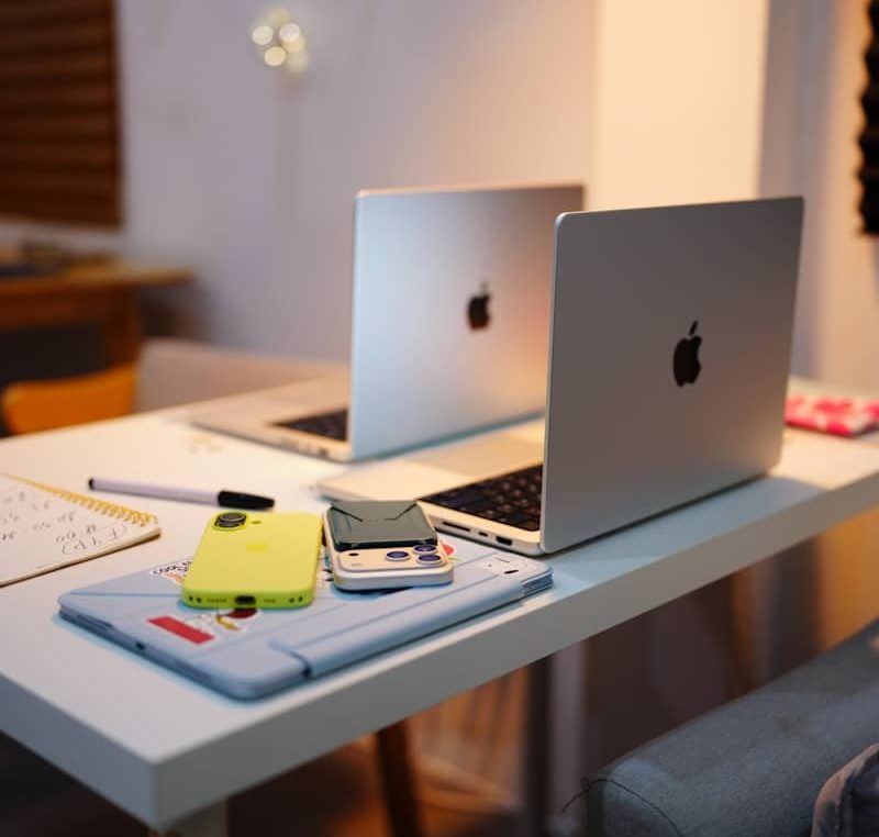 Home workspace with laptop, notebook and highlighters